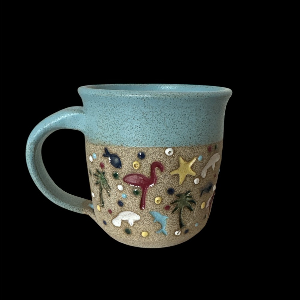 Signed Tropical Themed Textured Pottery Mug. 
(R  1 110125)